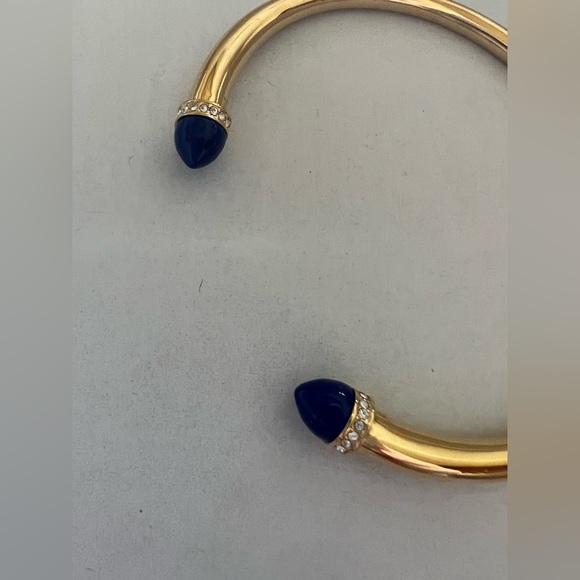Michael Kors
Gold Tone/ Blue Arrow Open Cuff Lapis Stones Bracelet - Picture 3 of 4